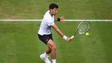 EASTBOURNE, ENGLAND - JUNE 29: Novak Djokovic of Serbia hits a backhand during the men's singles quarter final match against Donald Young of The United States on day five of the Aegon International Eastbourne at Devonshire Park Lawn Tennis Club on June 29, 2017 in Eastbourne, England. (Photo by Mike Hewitt/Getty Images)