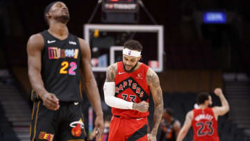 Gary Trent Jr. #33 of the Toronto Raptors reacts with Jimmy Butler #22 of the Miami Heat(Photo by Cole Burston/Getty Images)