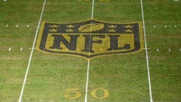 Jan 17, 2016; Charlotte, NC, USA; General view of NFL golden shield logo at midfield to commemorate Super Bowl 50 during the in a NFC Divisional round playoff game between the Seattle Seahawks and the Carolina Panthers at Bank of America Stadium. Mandatory Credit: Kirby Lee-USA TODAY Sports