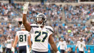 CHARLOTTE, NC - NOVEMBER 25: Mike Davis #27 of the Seattle Seahawks waves to the Carolina Panthers fans after a touchdown during the fourth quarter of their game at Bank of America Stadium on November 25, 2018 in Charlotte, North Carolina. The Seahawks won 30-27. (Photo by Grant Halverson/Getty Images)