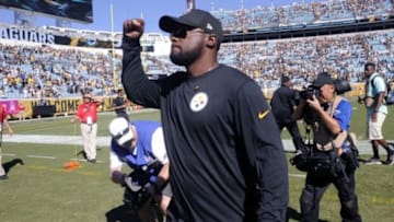 Oct 5, 2014; Jacksonville, FL, USA; Pittsburgh Steelers head coach Mike Tomlin celebrates as he comes off the field as the Steelers beat the Jacksonville Jaguars 17-9 at EverBank Field. Mandatory Credit: David Manning-USA TODAY Sports