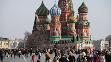 Visitors walk through Red Square near Saint Basil's cathedral in Moscow, Russia, on Tuesday, April 10, 2018. Russias currency extended its plunge, dropping to the weakest level since Dec. 2016, as investors weighed the implications of the toughest U.S. sanctions yet. Photographer: Andrey Rudakov/Bloomberg via Getty Images