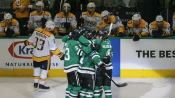 DALLAS, TX - APRIL 17: Dallas Stars left wing Jamie Benn (14) tries to deflect the puck past Nashville Predators goaltender Pekka Rinne (35) during the game between the Dallas Stars and the Nashville Predators on April 17, 2019 at the American Airlines Center in Dallas, Texas. (Photo by Matthew Pearce/Icon Sportswire via Getty Images)