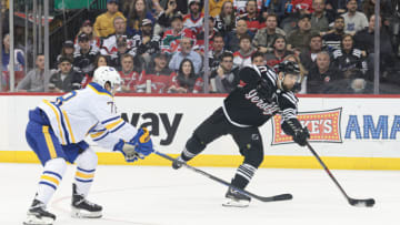Apr 11, 2023; Newark, New Jersey, USA; New Jersey Devils left wing Tomas Tatar (90) shoots the puck as Buffalo Sabres defenseman Jacob Bryson (78) defends during the first period at Prudential Center. Mandatory Credit: Vincent Carchietta-USA TODAY Sports