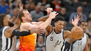 SAN ANTONIO,TX - MARCH 23 : Dejounte Murray #5 of the San Antonio Spurs steals the ball from Joe Ingles #2 of the Utah jazz at AT&T Center on March 23, 2018 in San Antonio, Texas. (Photo by Ronald Cortes/Getty Images)