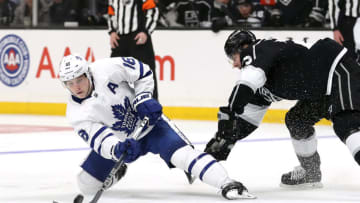 LOS ANGELES, CALIFORNIA - MARCH 05: Mitchell Marner #16 of the Toronto Maple Leafs takes a slapshot against Dustin Brown #23 of the Los Angeles Kings during the third period at Staples Center on March 05, 2020 in Los Angeles, California. (Photo by Katelyn Mulcahy/Getty Images)