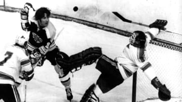 BOSTON, MA - MAY 7: Derek Sanderson #16 of the Boston Bruins looks surprised as goalie Glenn Hall #1 of the St. Louis Blues makes the kick save as he holds onto the net as his teammate Jean-Guy Talbot #17 looks on during Game 3 of the 1970 Stanley Cup Finals on May 7, 1970 at the Boston Garden in Boston, Massachusetts. The Bruins defeated the Blues 4-1. (Photo by B Bennett/Getty Images)