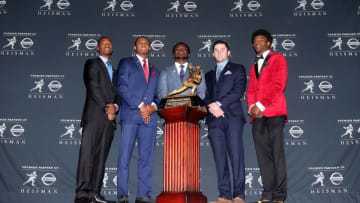 Dec 10, 2016; New York, NY, USA; Heisman finalists Oklahoma wide receiver Dede Westbrook (left to right) and Clemson quarterback Deshaun Watson and Michigan linebacker Jabrill Peppers and Oklahoma quarterback Baker Mayfield and Louisville quarterback Lamar Jackson pose with the Heisman trophy during a press conference at the New York Marriott Marquis before the 2016 Heisman Trophy awards ceremony. Mandatory Credit: Brad Penner-USA TODAY Sports