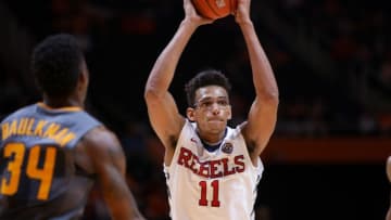 Mar 5, 2016; Knoxville, TN, USA; Mississippi Rebels forward Sebastian Saiz (11) passes the ball in front of Tennessee Volunteers guard Devon Baulkman (34) during the second half at Thompson-Boling Arena. The Rebels won 83 to 60. Mandatory Credit: Randy Sartin-USA TODAY Sports