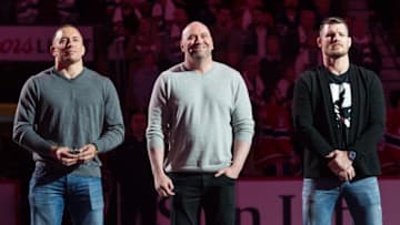 MONTREAL, QC - OCTOBER 14: President of the UFC Dana White stands in-between Georges St-Pierre (L) and defending middleweight UFC champion Michael Bisping during the NHL game between the Montreal Canadiens and the Toronto Maple Leafs at the Bell Centre on October 14, 2017 in Montreal, Quebec, Canada. (Photo by Minas Panagiotakis/Getty Images)