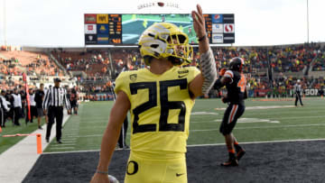 CORVALLIS, OREGON - NOVEMBER 23: Running back Travis Dye #26 of the Oregon Ducks celebrates after scoring a touchdown during the second half of the game against the Oregon State Beavers at Reser Stadium on November 23, 2018 in Corvallis, Oregon. (Photo by Steve Dykes/Getty Images)