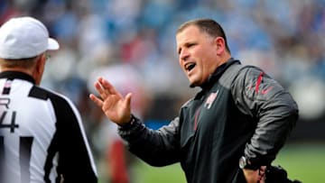 CHARLOTTE, NC - DECEMBER 01: Coach Greg Schiano of the Tampa Bay Buccaneers argues with referee Ron Winter