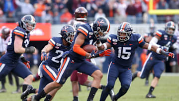 CHARLOTTESVILLE, VA - NOVEMBER 29: Noah Taylor #14 of the Virginia Cavaliers makes an interception in the second half during a game against the Virginia Tech Hokies at Scott Stadium on November 29, 2019 in Charlottesville, Virginia. (Photo by Ryan M. Kelly/Getty Images)