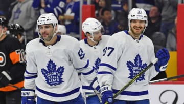 Apr 2, 2022; Philadelphia, Pennsylvania, USA; Toronto Maple Leafs defenseman Timothy Liljegren (37) celebrates his goal with defenseman Mark Giordano (55) against the Philadelphia Flyers during the second period at Wells Fargo Center. Mandatory Credit: Eric Hartline-USA TODAY Sports