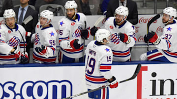 TORONTO, ON - JANUARY 12: C.J. Smith #19 of the Rochester Americans celebrates his goal with teammates against the Rochester Americans during AHL game action on January 12, 2019 at Coca-Cola Coliseum in Toronto, Ontario, Canada. (Photo by Graig Abel/Getty Images)