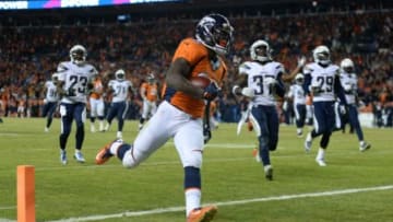 Jan 3, 2016; Denver, CO, USA; Denver Broncos running back Ronnie Hillman (23) scores a touchdown in the fourth quarter against the San Diego Chargers at Sports Authority Field at Mile High. The Broncos defeated the Chargers 27-20. Mandatory Credit: Ron Chenoy-USA TODAY Sports