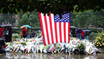 Mourners pay their respects outside the U.S. Embassy in London on September 13, 2001.