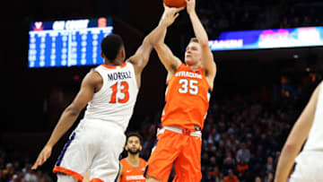 CHARLOTTESVILLE, VA - JANUARY 11: Buddy Boeheim #35 of the Syracuse Orange shoots over Casey Morsell #13 of the Virginia Cavaliers in the first half during a game at John Paul Jones Arena on January 11, 2020 in Charlottesville, Virginia. (Photo by Ryan M. Kelly/Getty Images)