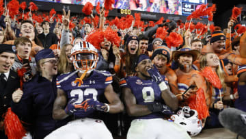 Auburn footballOct 30, 2021; Auburn, Alabama, USA; Auburn Tigers cornerback Trey Elston (22) and linebacker Zakoby McClain (9) celebrate with fans defeating the Mississippi Rebels at Jordan-Hare Stadium. Mandatory Credit: John Reed-USA TODAY Sports