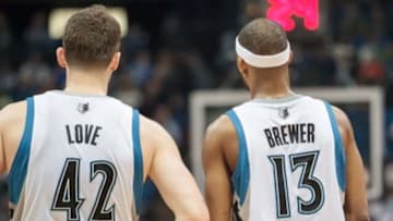 Apr 16, 2014; Minneapolis, MN, USA; Minnesota Timberwolves forward Kevin Love (42) and forward Corey Brewer (13) at Target Center. Mandatory Credit: Brad Rempel-USA TODAY Sports