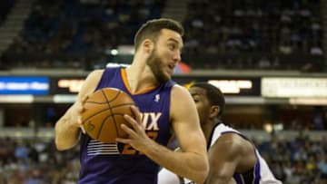 Apr 16, 2014; Sacramento, CA, USA; Phoenix Suns center Miles Plumlee (22) drives in against Sacramento Kings forward Jason Thompson (34) during the first quarter at Sleep Train Arena. Mandatory Credit: Kelley L Cox-USA TODAY Sports