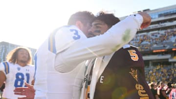 TEMPE, AZ - NOVEMBER 10: Quarterback Manny Wilkins #5 of the Arizona State Sun Devils hugs quarterback Wilton Speight #3 of the UCLA Bruins after the game at Sun Devil Stadium on November 10, 2018 in Tempe, Arizona. The Arizona State Sun Devils won 31-28. (Photo by Jennifer Stewart/Getty Images)