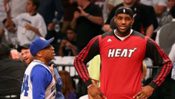 May 12, 2014; Brooklyn, NY, USA; American director Spike Lee talks with Miami Heat forward LeBron James (6) before the game against the Brooklyn Nets in game four of the second round of the 2014 NBA Playoffs at Barclays Center. Mandatory Credit: Anthony Gruppuso-USA TODAY Sports