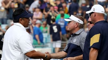 JACKSONVILLE, FL - NOVEMBER 05: Head coach Brian Kelly of the Notre Dame Fighting Irish (R) shakes hands with with head coach Ken Niumatalolo of the Navy Midshipmen following the game at EverBank Field on November 5, 2016 in Jacksonville, Florida. Navy won the game 28-27. (Photo by Sam Greenwood/Getty Images)