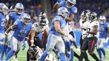 Lions linebacker Malcolm Rodriguez (foreground) celebrates with teammates after a tackle on Atlanta Falcons kick returner Avery Williams (35) during the first half of a preseason game Aug.12, 2022 at Ford Field.Lions Atl