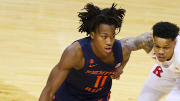 PISCATAWAY, NJ - DECEMBER 20: Ayo Dosunmu #11 of the Illinois Fighting Illini in action against Jacob Young #42 of the Rutgers Scarlet Knights during a college basketball game at Rutgers Athletic Center on December 20, 2020 in Piscataway, New Jersey. Rutgers defeated Illinois 91-88. (Photo by Rich Schultz/Getty Images)