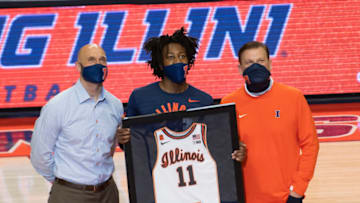 Feb 25, 2021; Champaign, Illinois, USA; Illinois Fighting Illini guard Ayo Dosunmu (11) celebrates with head coach Brad Underwood and Athletic Director Josh Whitman during senior night prior to a game against the Nebraska Cornhuskers at the State Farm Center. Mandatory Credit: Patrick Gorski-USA TODAY Sports