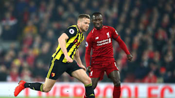 LIVERPOOL, ENGLAND - FEBRUARY 27: Tom Cleverley of Watford is challenged by Naby Keita of Liverpool during the Premier League match between Liverpool FC and Watford FC at Anfield on February 27, 2019 in Liverpool, United Kingdom. (Photo by Clive Brunskill/Getty Images)