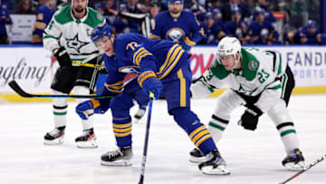 Jan 20, 2022; Buffalo, New York, USA; Buffalo Sabres right wing Tage Thompson (72) gets control over the puck as Dallas Stars defenseman Esa Lindell (23) tries to defend during the second period at KeyBank Center. Mandatory Credit: Timothy T. Ludwig-USA TODAY Sports