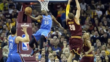 Dec 17, 2015; Cleveland, OH, USA; Oklahoma City Thunder forward Kevin Durant (35) drives to the basket against Cleveland Cavaliers center Timofey Mozgov (20) in the first quarter at Quicken Loans Arena. Mandatory Credit: David Richard-USA TODAY Sports