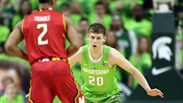 Jan 23, 2016; East Lansing, MI, USA; Maryland Terrapins guard Melo Trimble (2) is defended by Michigan State Spartans guard Matt McQuaid (20) during the second half of a game at Jack Breslin Student Events Center. Mandatory Credit: Mike Carter-USA TODAY Sports
