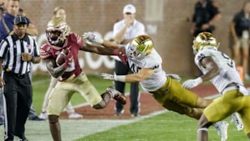 Florida State Seminoles running back Jashaun Corbin (0) pushes off a tackle. The Notre Dame Fighting Irish defeat the Florida State Seminoles 41-38 at Doak Campbell Stadium on Sunday, Sept. 5, 2021.Fsu V Notre Dame1753