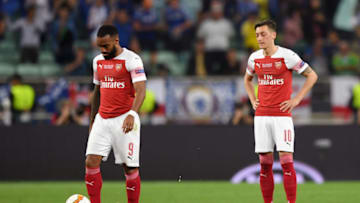 BAKU, AZERBAIJAN - MAY 29: Mesut Ozil of Arsenal and Alexandre Lacazette of Arsenal react to Chelsea scoring their first goal during the UEFA Europa League Final between Chelsea and Arsenal at Baku Olimpiya Stadionu on May 29, 2019 in Baku, Azerbaijan. (Photo by Shaun Botterill/Getty Images)