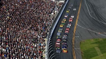 Feb 22, 2015; Daytona Beach, FL, USA; NASCAR Sprint Cup Series driver Jimmie Johnson (48) and Joey Logano (22) lead the field during a restart during the Daytona 500 at Daytona International Speedway. Mandatory Credit: Andrew Weber-USA TODAY Sports