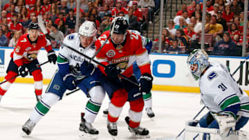 SUNRISE, FL - OCTOBER 13: Goaltender Anders Nilsson #31 of the Vancouver Canucks defends the net with the help of teammate Bo Horvat #53 against Troy Brouwer #22 of the Florida Panthers at the BB&T Center on October 13, 2018 in Sunrise, Florida. (Photo by Eliot J. Schechter/NHLI via Getty Images)