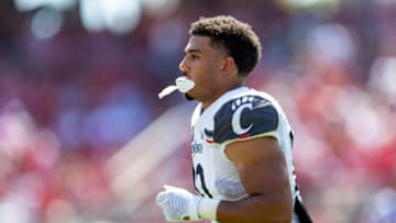 Ryan Montgomery of the Cincinnati Bearcats comes off the field against the Arkansas Razorbacks. Getty Images.
