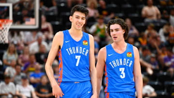 Chet Holmgren #7 of the Oklahoma City Thunder speaks with teammate Josh Giddey #3. (Photo by Alex Goodlett/Getty Images)