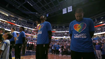 Oct 26, 2016; Orlando, FL, USA; Orlando Magic forward Jeff Green (34), Orlando Magic guard C.J. Watson (32) and teammates wears an Orlando United shirt in tribute to the victims of the Pulse terror attack during the national anthem against the Miami Heat at Amway Center. Mandatory Credit: Kim Klement-USA TODAY Sports