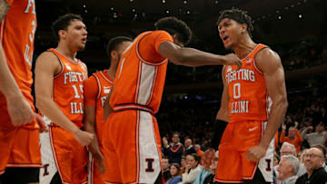 Dec 6, 2022; New York, New York, USA; Illinois Fighting Illini guard Terrence Shannon Jr. (0) celebrates with teammates during overtime against the Texas Longhorns at Madison Square Garden. Mandatory Credit: Brad Penner-USA TODAY Sports