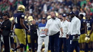 Jan 1, 2016; Glendale, AZ, USA; Notre Dame Fighting Irish head coach Brian Kelly talks with Notre Dame Fighting Irish quarterback DeShone Kizer (14) during a timeout in the first half of the 2016 Fiesta Bowl at University of Phoenix Stadium. Mandatory Credit: Joe Camporeale-USA TODAY Sports