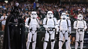 PHOENIX, ARIZONA - JULY 29: Actors portraying Star Wars characters 'Darth Vader' and 'stormtroopers' pose on the field before the MLB game between the Arizona Diamondbacks and the Seattle Mariners at Chase Field on July 29, 2023 in Phoenix, Arizona. (Photo by Christian Petersen/Getty Images)