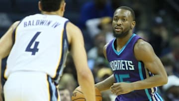 Nov 28, 2016; Memphis, TN, USA; Charlotte Hornets guard Kemba Walker (15) drives against Memphis Grizzlies guard Wade Baldwin IV (4) in the second half at FedExForum. Charlotte defeated Memphis 104-85. Mandatory Credit: Nelson Chenault-USA TODAY Sports
