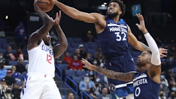 Minnesota Timberwolves center Karl-Anthony Towns blocks a pass by Los Angeles Clippers guard Eric Bledsoe. Mandatory Credit: Kiyoshi Mio-USA TODAY Sports