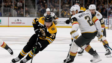 Dec 5, 2022; Boston, Massachusetts, USA; Boston Bruins left wing Taylor Hall (71) goes around Vegas Golden Knights defenseman Zach Whitecloud (2) during the first period at TD Garden. Mandatory Credit: Winslow Townson-USA TODAY Sports