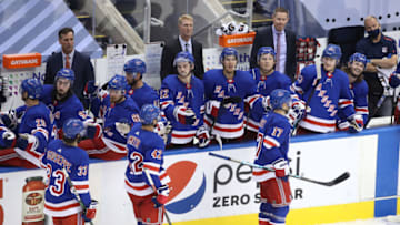 TORONTO, ONTARIO - JULY 29: Phillip Di Giuseppe #33, Brendan Smith #42 and Jesper Fast #17 of the New York Rangers celebrate the goal of teammate Filip Chytil with teammates on the bench in third period against the New York Islanders during an exhibition game prior to the 2020 NHL Stanley Cup Playoffs at Scotiabank Arena on July 29, 2020 in Toronto, Ontario. (Photo by Andre Ringuette/Freestyle Photo/Getty Images)