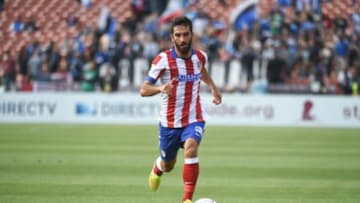 July 27, 2014; San Francisco, CA, USA; Atletico Madrid player Arda Turan (10) controls the ball against the San Jose Earthquakes during the first half at Candlestick Park. Mandatory Credit: Kyle Terada-USA TODAY Sports